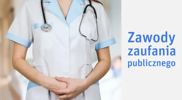 Osoba w białym fartuchu z niebieskimi wykończeniami, ze stetoskopem na szyi, symbolizuje zawód zaufania publicznego.